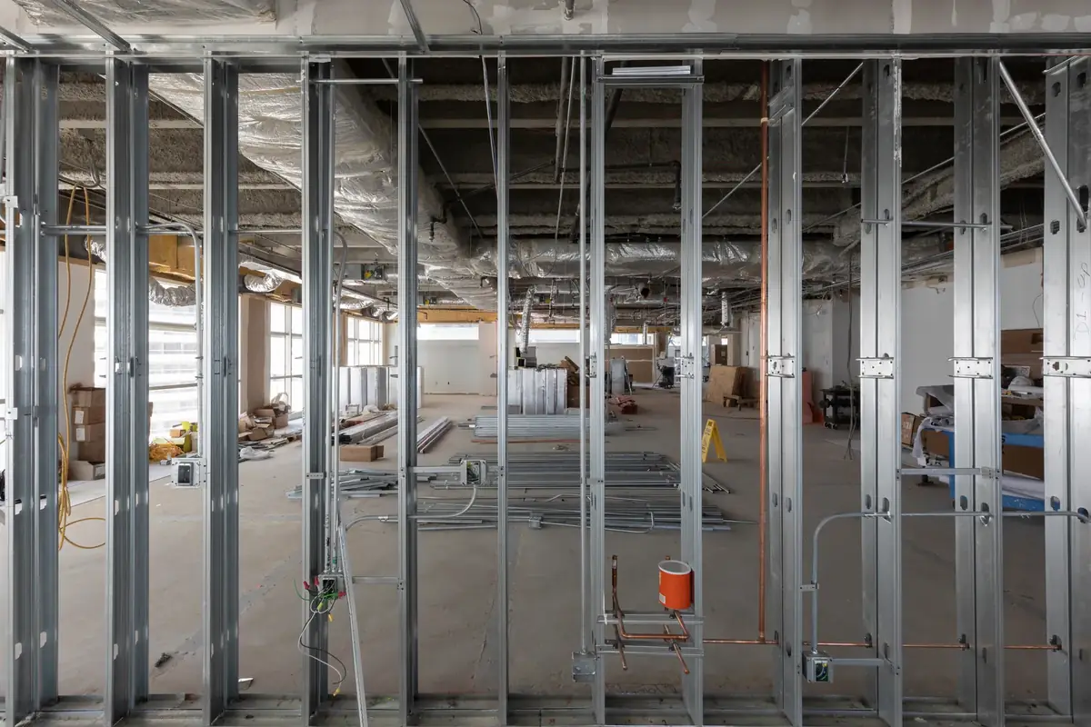 Steel stud framing on an open floor plate